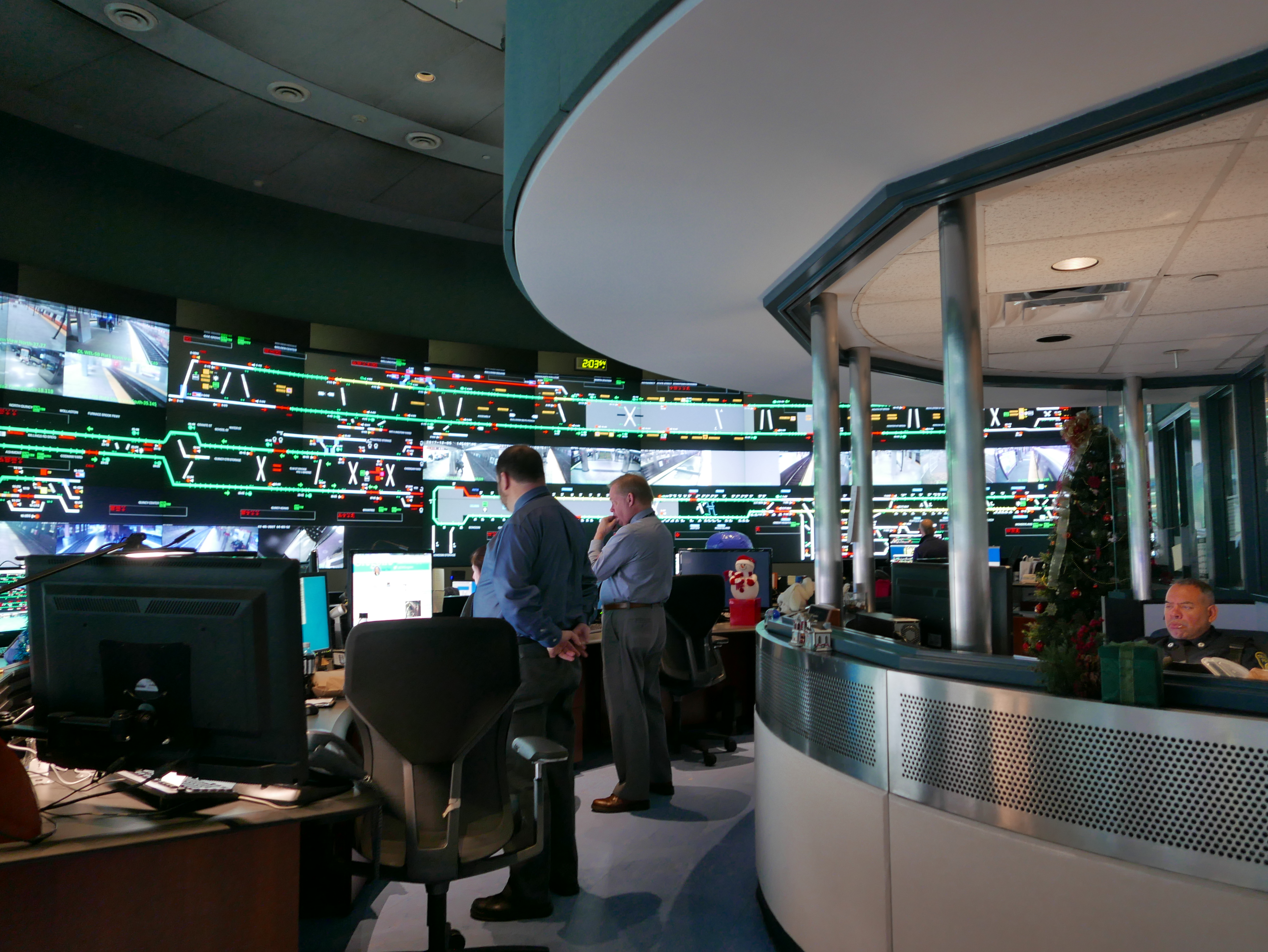 A room full of computers and monitors all along the wall